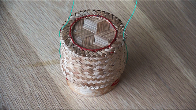 This is a kratip, a traditional woven bamboo container.