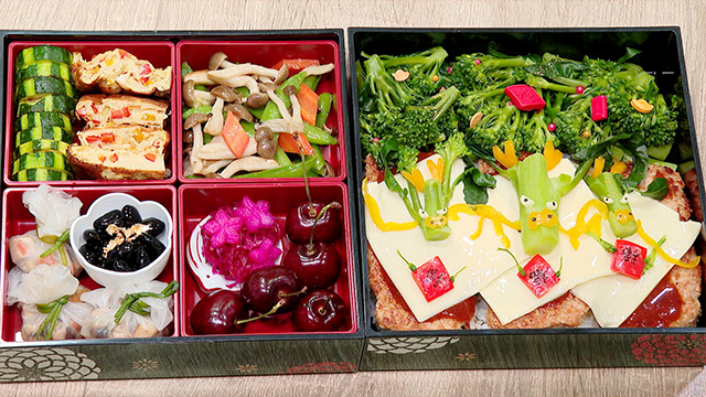 A festive and satisfying bento packed with colorful veggies and fruit, perfect for celebrating the arrival of the Year of the Dragon.