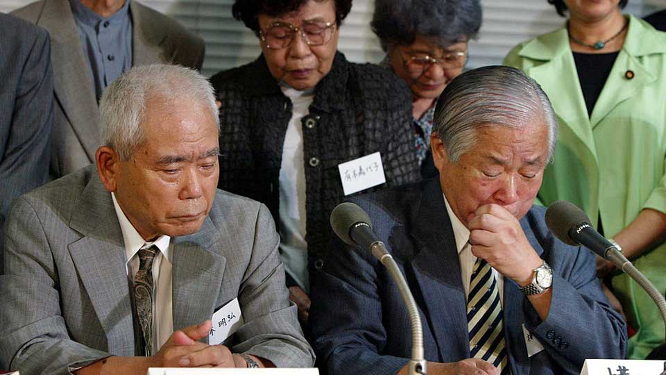 Picture of family members of Japanese nationals, abducted by North Korean agents in the 1970s and 80s, speaking to the media after they were informed of the deaths of their children.