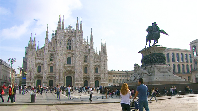 Today, from Milan, the largest city in northern Italy. Its landmark, the Milan Cathedral, is one of the world’s largest Gothic buildings.