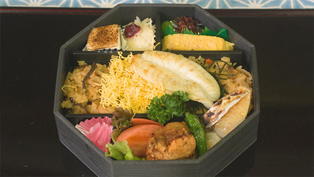 In the center is a serving of grilled fugu that's been sundried overnight to remove the excess moisture and concentrate the umami flavor. It's a favorite with local fishers. A bento filled with a medley of fugu dishes. Yum!